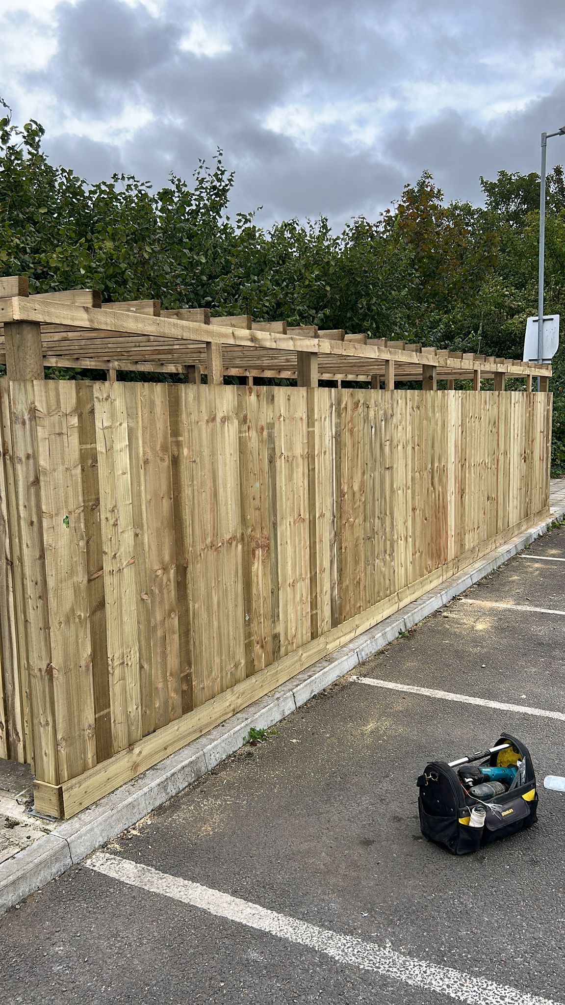 Long run of newly installed timber fencing